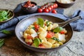 Gnocchi pasta salad with fresh and steamed spinach, sun dried tomatoes and Parmesan cheese