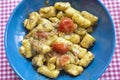 Gnocchi with pesto and fresh tomatoes Royalty Free Stock Photo