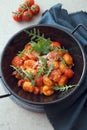 Gnocchi with tomatoes and rocket