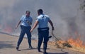 GNR police officers are fighting against the flames