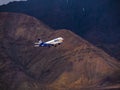 Go Air indian passenger plane fly up from Leh airport surrounded by Himalaya mountain range