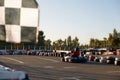 Go-cart racer moving fast on open air motor racing track