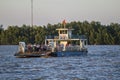 GO CONG, VIETNAM - MAY 07, 2016 - Tourists and cars loaded on a ferry and headed for the Go Cong Isle, Tien Giang province, Vietn