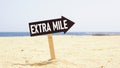 Go the extra mile is shown using the text on the road sign Royalty Free Stock Photo