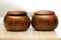 Go game stones in wooden bowls - Goban, Baduk, Weiqi or Maklom - Traditional asian strategy board game