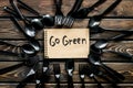 Go green. Eco concept and injunction on the use of plastic flatware on wooden background top view