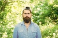 Go green think fresh. Protect nature eco movement. Man handsome bearded guy in sunny forest. United with environment Royalty Free Stock Photo