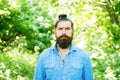 Go green think fresh. Protect nature eco movement. Man handsome bearded guy in sunny forest. United with environment Royalty Free Stock Photo