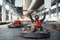 Go kart racer raised his hands up, front view Royalty Free Stock Photo