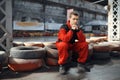Go kart racer sitting on tires, karting auto sport Royalty Free Stock Photo