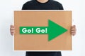 Go! Go!  man written text on broad arrow pointing to gold sign copy spaces Royalty Free Stock Photo