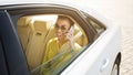 Go on taxi. Woman talking on phone in car Royalty Free Stock Photo