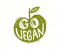 Go vegan slogan. Hand lettering in the shape of green apple.