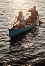 Go where the row takes you. a young couple rowing a boat out on the lake. Royalty Free Stock Photo
