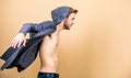 Go wild. male fashion and beauty. perfect torso body of muscular man. man in trendy hooded jacket. sexy macho in denim