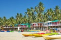 Goa beach Palolem India, colorful bungalows under the palm tree Royalty Free Stock Photo