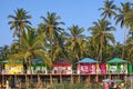 Goa beach Palolem India, colorful bungalows under the palm tree Royalty Free Stock Photo