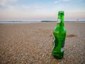 A cold bottle of Tuborg in the sand on a hot, summer's day Royalty Free Stock Photo