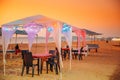 Goa, India. Gazebo Tents With Lamp For Tourists On Beach With Tables And Chairs Inside In Sunset Time Royalty Free Stock Photo