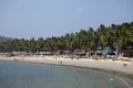 GOA, INDIA - JANUARY 31, 2014:Vacationers, sellers, cafe on the tropical beach Palolem Royalty Free Stock Photo