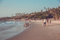 GOA, INDIA - MARCH 4: Family are walking at Little Vagator Beach