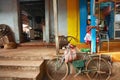 GOA, INDIA, May 2012, Girl at cycle repair shop in Bicholim market North Goa.