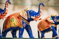 Goa, India. Painted Elephant Souvenir Of Porcelain On Shelf In Store. Goods For Tourists