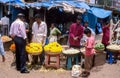 Goa, India: Unidentified men selling flowers in a market stall