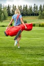 Goal concept, copy space. Women golfing time holding golf equipment on green field background. The pursuit of excellence Royalty Free Stock Photo