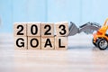 2023 goal cube blocks with miniature truck or construction vehicle. New Start, Vision, Resolution, goal, industrial, Warehouse and