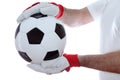 Goal keeper takes a soccer ball