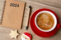 2024 GOAL with notebook, coffee cup, Christmas cookies and pen on wood table. Xmas, Happy New Year, Resolution, To do list, Royalty Free Stock Photo