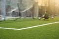 Blurred football background: goalkeeper catches the ball during game moment