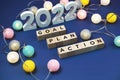 2022 Goal Plan Action alphabet letter decorate with LED cotton ball on blue background