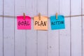 Goal, plan, action text on colorful paper note hanging with clothespin Royalty Free Stock Photo