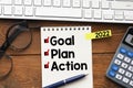 Goal,plan,action text on notepad with office accessories.Business motivation,inspiration concepts ideas Royalty Free Stock Photo