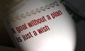 A goal without a plan is just a wish words on copybooks page laying on 100 Euros bills. Personal goal setting business Royalty Free Stock Photo