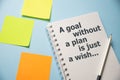 A goal without a plan is just a wish words on copybooks. Personal goal setting business coaching concept.