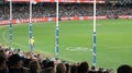 Goal posts line and crowd watching footy at Docklands Stadium, Melbourne Royalty Free Stock Photo