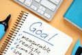 Goal setting concept. Notepad with pen on desk Royalty Free Stock Photo