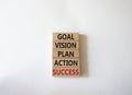Goal Vision Plan Action Success symbol. Concept words Goal Vision Plan Action Success on wooden blocks. Beautiful white background Royalty Free Stock Photo