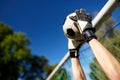 Goalkeeper with ball at football goal on field