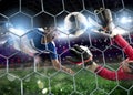 Goalkeeper catches the ball in the stadium during a football game. Royalty Free Stock Photo