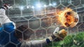 Goalkeeper catches a fast fiery soccer ball