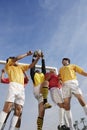 Goalkeeper Jumping To Save Goal Against Sky Royalty Free Stock Photo