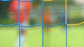Goalkeeper movement in small limes, europen fotball play in kids level. Abstract out of focus.