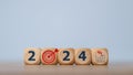 2024 goals of business or life. Wooden cubes with 2024 and goal icon on smart background. Starting to new year. Business common Royalty Free Stock Photo