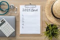 2021 goals on clipboard medical note pad for new year reminder list of yearly planner, health plan for work-life balance on desk Royalty Free Stock Photo