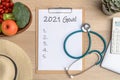 2021 goals on clipboard note pad for new year reminder list of yearly planner, health plan for work-life balance on desk Royalty Free Stock Photo