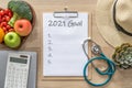 2021 goals on clipboard note pad for new year reminder list of yearly planner, health plan for work-life balance on desk Royalty Free Stock Photo